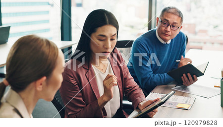 Meeting, tablet and group of business people in discussion, solution and cooperation with mature CEO. Japanese team, collaboration and planning project for investment, finance and revenue in office 120979828