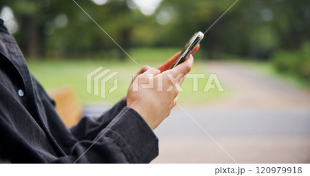 Hands, person and typing with phone at park of travel guide, communication and location directions. Tourist, mobile app and contact chat, texting and vacation information for morning commute in Japan Hands, person and typing with phone at park of travel guide, communication and location directions. Tourist, mobile app and contact chat, texting and vacation information for morning commute in Japan 120979918