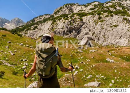 Young Woman Walking Alone in Mountain Path 120981881