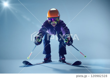 Love English view of athlete ready to leaps, poles extended backward, against softly illuminated blue backdrop. Love English view of athlete ready to leaps, poles extended backward, against softly illuminated blue backdrop. 120982328
