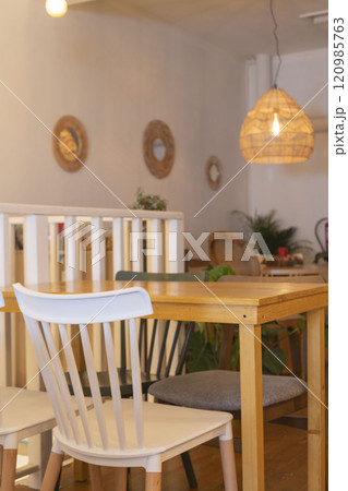 Cozy cafe interior with white chairs Cozy cafe interior with white chairs 120985763