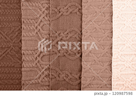 Demonstrating the colors of 2025 - Mocha Mousse. Knitted abstract background in different shades in trendy colors 2025. Large knitted blanket or sweater with pattern. Color concept. Demonstrating the colors of 2025 - Mocha Mousse. Knitted abstract background in different shades in trendy colors 2025. Large knitted blanket or sweater with pattern. Color concept. 120987598