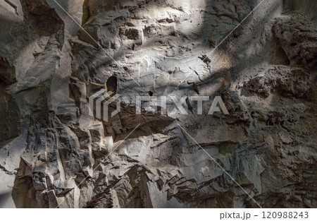 Elegance of The intricate natural light and shadow on surface of stone wall. Elegance of The intricate natural light and shadow on surface of stone wall. 120988243
