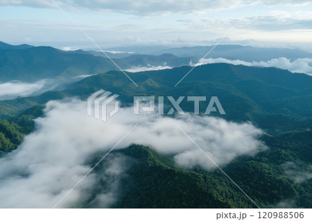 Aerial view of foggy wooded mountain range in the morning 120988506