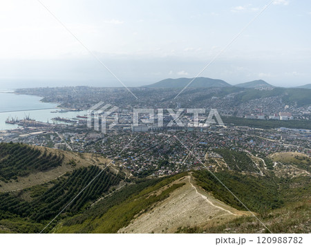 Panoramic view of Novorossiysk City and Tsemess Bay at sunrise. Morning cityscape of large port at Black Sea coast in Russia Panoramic view of Novorossiysk City and Tsemess Bay at sunrise. Morning cityscape of large port at Black Sea coast in Russia 120988782