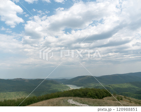 Birds eye view of the Caucasian mountain range and the mountain lake Neberdzhaevskoe reservoir near Novorossiysk in the Krasnodar Region Birds eye view of the Caucasian mountain range and the mountain lake Neberdzhaevskoe reservoir near Novorossiysk in the Krasnodar Region 120988851