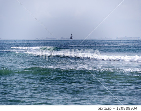 Novorossiysk, Russia 28 August 2024 Bulk carrier and lighthouse in the port in the Black Sea coast Novorossiysk, Russia 28 August 2024 Bulk carrier and lighthouse in the port in the Black Sea coast 120988934