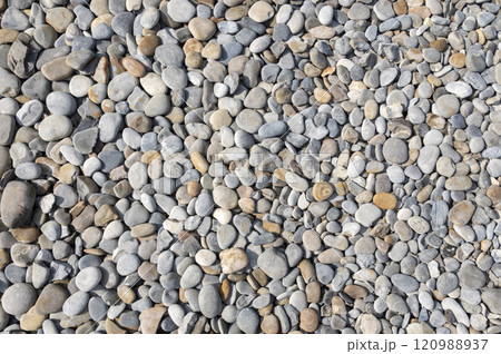 Collection of natural river stones with a rough texture and gray color 120988937