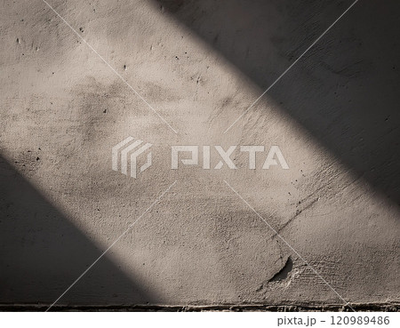Textured Concrete Wall with Natural Light 120989486