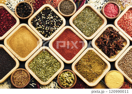 Colorful mix of herb and spice varieties: curry and coriander, turmeric and cumin, paprika and pepper, mustard and salt, cardamon and oregano and saffron. Food ingredients background	 120990011
