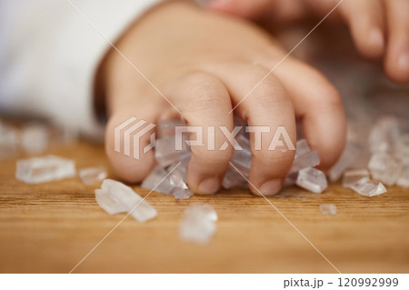 close-up of little child girl hand holds small cubes of soap for hand-made soap, art workshops for children. close-up of little child girl hand holds small cubes of soap for hand-made soap, art workshops for children. 120992999