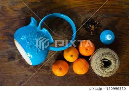 tea, tangerines, nuts and spices on a wooden table. Winter breakfast. The concept of hygge. tea, tangerines, nuts and spices on a wooden table. Winter breakfast. The concept of hygge. 120996350