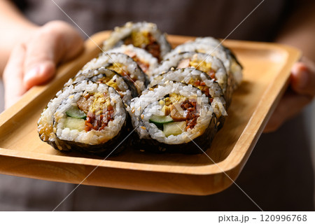 Korean Gimbap or kimbap made from cooked rice with vegetables, meat and wrapped with dried seaweed 120996768