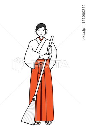 ほうきで掃除する神社の巫女、白衣と緋袴 121000252