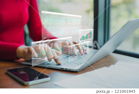 Professional women wearing red sweater working about new startup on laptop to analysis finance of project in outside office, Woman working using laptop online meeting in home office. 121001945