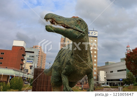 Animatronic robot dinosaur statues at Fukui train and bus stations in Fukui City in Japan 121005647