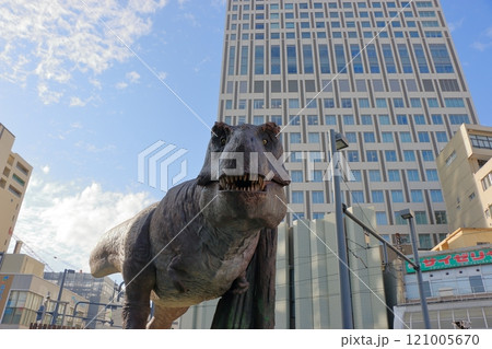 Animatronic robot dinosaur statues at Fukui train and bus stations in Fukui City in Japan 121005670