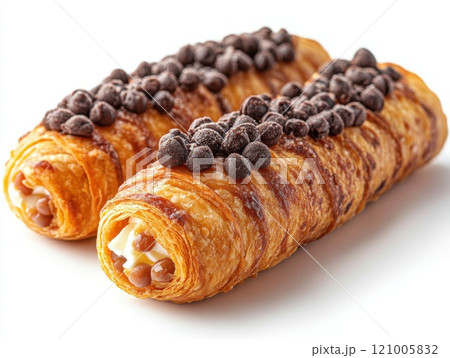 Cannoli, a traditional Italian dessert featuring crispy pastry tubes filled with creamy ricotta cheese 121005832