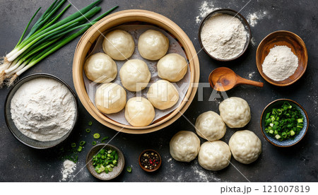 Fresh dumpling ingredients including flour, scallions, and dumplings Fresh dumpling ingredients including flour, scallions, and dumplings 121007819