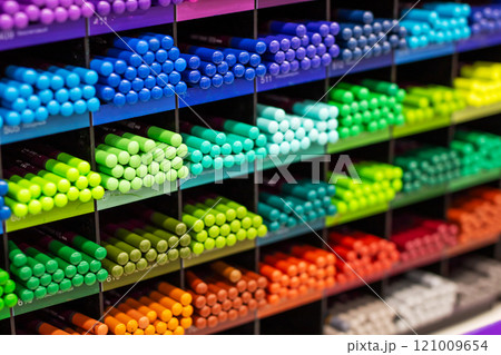 A diverse set of colored pencils is beautifully lined up on a rack A diverse set of colored pencils is beautifully lined up on a rack 121009654