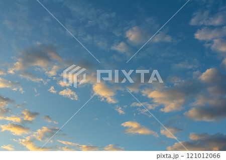 Ornamental clouds. Dramatic sky. Epic storm cloudscape Soft sunlight. Panoramic image texture background graphic resources design Meteorology, heaven hope peace concept 121012066