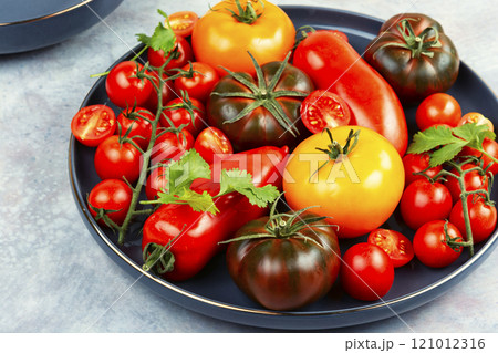Tomatoes of different varieties in a plate 121012316