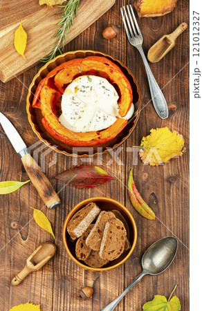 Pumpkin stuffed filled with camembert cheese. Pumpkin stuffed filled with camembert cheese. 121012327
