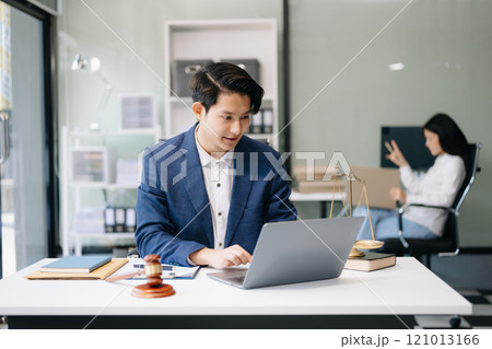 Asian man lawyer working and gavel, tablet, laptop in front, Advice justice and law concept. 121013166
