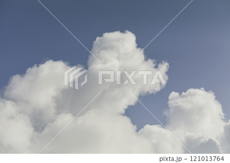 White cumulus clouds against blue sky 121013764