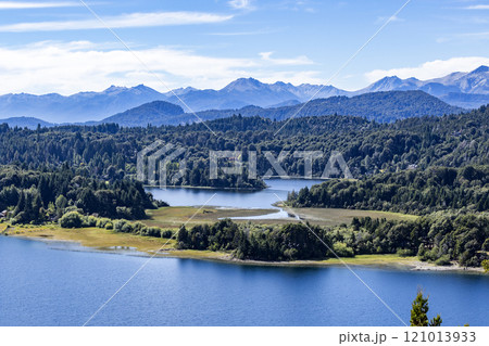 High angle view of mountain lakes and forests on sunny summer day High angle view of mountain lakes and forests on sunny summer day 121013933