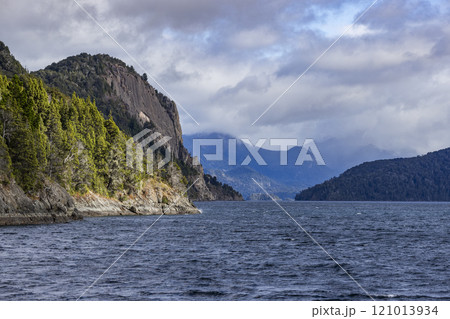 Clouds over rugged shoreline of Lake Nahuel Huapi 121013934