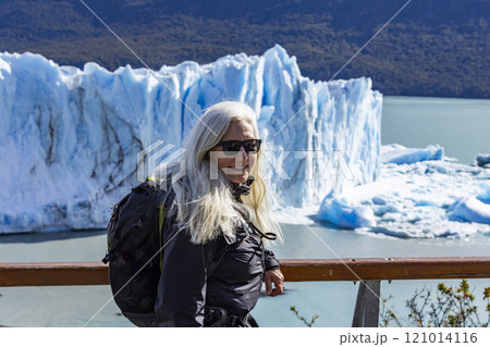 Argentina, Santa Cruz, El Calafate, Portrait of woman at Perito Moreno glacier ice formations 121014116