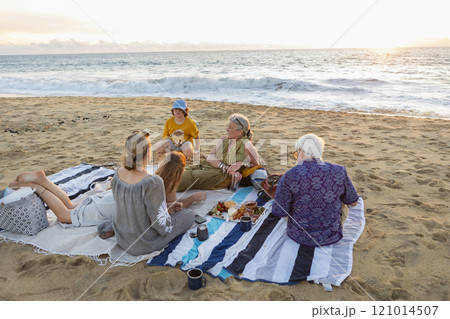 Mexico, Baja, Pescadero, Three generation family having picnic on beach 121014507