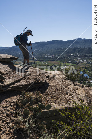 Usa, Colorado, Durango, Woman standing on ledge in San Juan Mountains Usa, Colorado, Durango, Woman standing on ledge in San Juan Mountains 121014544