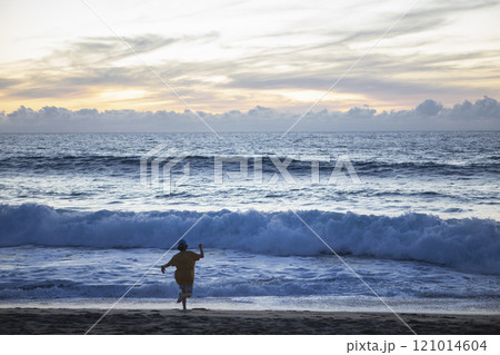 Mexico, Baja, Pescadero, Silhouette of boy on beach at dusk Mexico, Baja, Pescadero, Silhouette of boy on beach at dusk 121014604