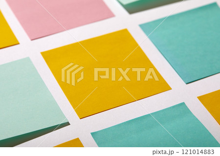 Close-up of colorful blank adhesive notes on white background 121014883