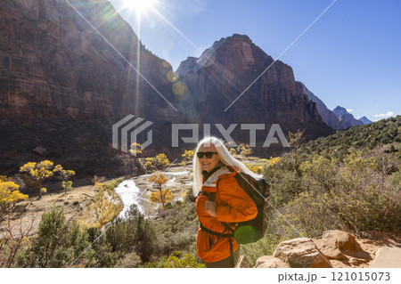 Portrait of woman hiking near Angels Landing Trail overlooking Virgin River 121015073