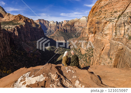 Portrait of senior couple looking at Zion Canyon from Zion Overlook 121015097