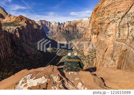 Rear view of couple wrapped in blanket looking at Zion Canyon from Zion Overlook Rear view of couple wrapped in blanket looking at Zion Canyon from Zion Overlook 121015099