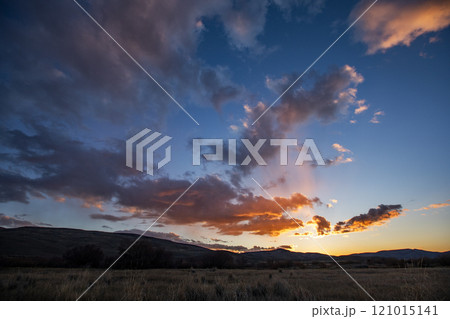 Romantic sky at sunset above landscape 121015141