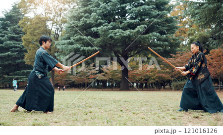 Wooden sword, Japanese people and outdoor as martial arts for training, exercise and sports. Culture, weapon and heritage for fight, combat and practice as self defense technique for bojutsu in Japan Wooden sword, Japanese people and outdoor as martial arts for training, exercise and sports. Culture, weapon and heritage for fight, combat and practice as self defense technique for bojutsu in Japan 121016126