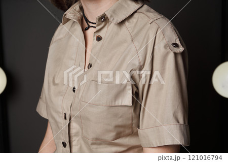 Women's plain beige shirt, pocket on chest, triangular buttons, shoulder straps Women's plain beige shirt, pocket on chest, triangular buttons, shoulder straps 121016794