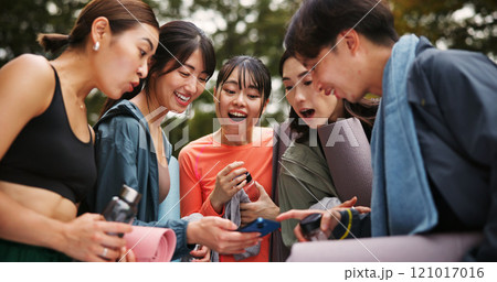 Fitness, people and surprised with phone outdoor for yoga routine video, pilates class announcement and research. Japanese group, smartphone and shocked at park for social media tips or online lesson 121017016