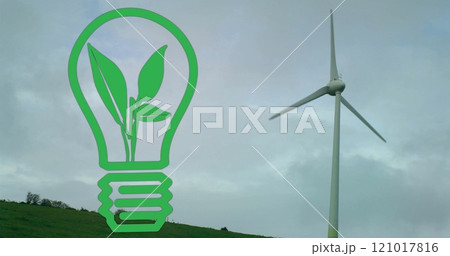 Image of plant in green light bulb over wind turbine against cloudy sky 121017816