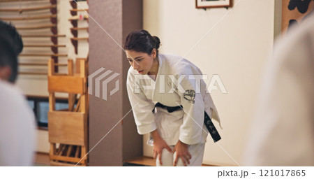 Martial arts, woman and bow with respect in dojo for honor, self defense training and discipline in class. Japanese culture, aikido and person with traditional greeting for etiquette and gratitude Martial arts, woman and bow with respect in dojo for honor, self defense training and discipline in class. Japanese culture, aikido and person with traditional greeting for etiquette and gratitude 121017865