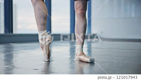 Ballerina, person and pointe feet in studio for dancing practice, performance rehearsal or recital. Ballet dancer, professional and balance in shoes for competition and talent at Japanese academy 121017943