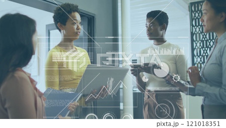Business data analytics image over diverse professionals discussing in office 121018351