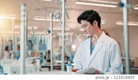 Technician, tablet and science with Japanese man in laboratory for equipment, research study and healthcare. Dialysis machine, biotechnology and solution with person in clinic for medical results Technician, tablet and science with Japanese man in laboratory for equipment, research study and healthcare. Dialysis machine, biotechnology and solution with person in clinic for medical results 121018887