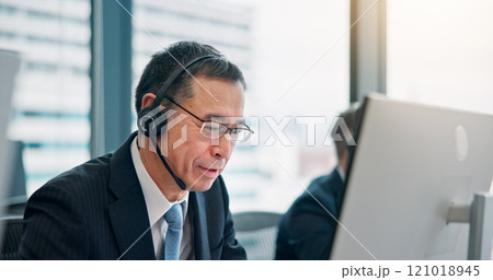 Mic, businessman and consulting with computer for call center, crm system and research for customer. Office, support and mature agent with headset for communication, telemarketing or service in Japan Mic, businessman and consulting with computer for call center, crm system and research for customer. Office, support and mature agent with headset for communication, telemarketing or service in Japan 121018945