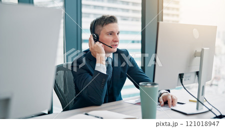 Call center, consultant and talking with microphone for customer service, technical support or CRM assistance. Japanese agency, man and headset by computer for FAQ advisory, help desk and contact us 121018947